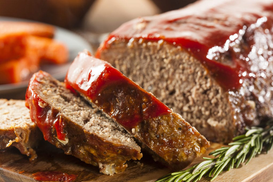 Meatloaf Slice and Meatloaf Sandwich with cheese and pickle Foodservice Recipe on a plate