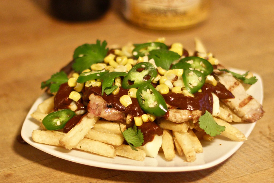 Pork Mole Poutine with organic chicken soup base