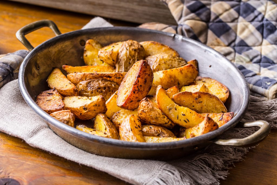 Roasted potatoes seasoned with Cook's Delight Roasted Garlic Concentrate Soup Base