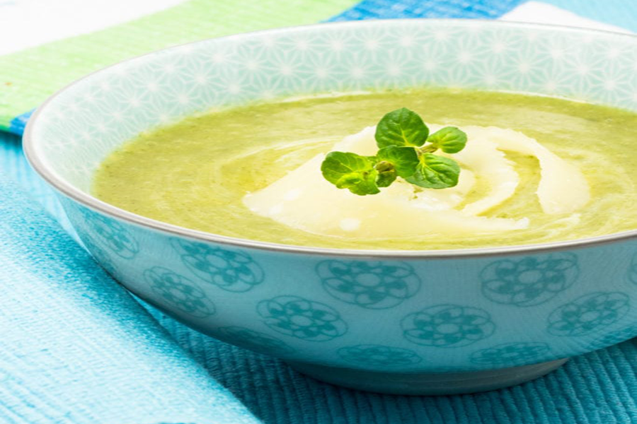 Cream of celery soup in bowl with Cook's Delight vegetable soup stock