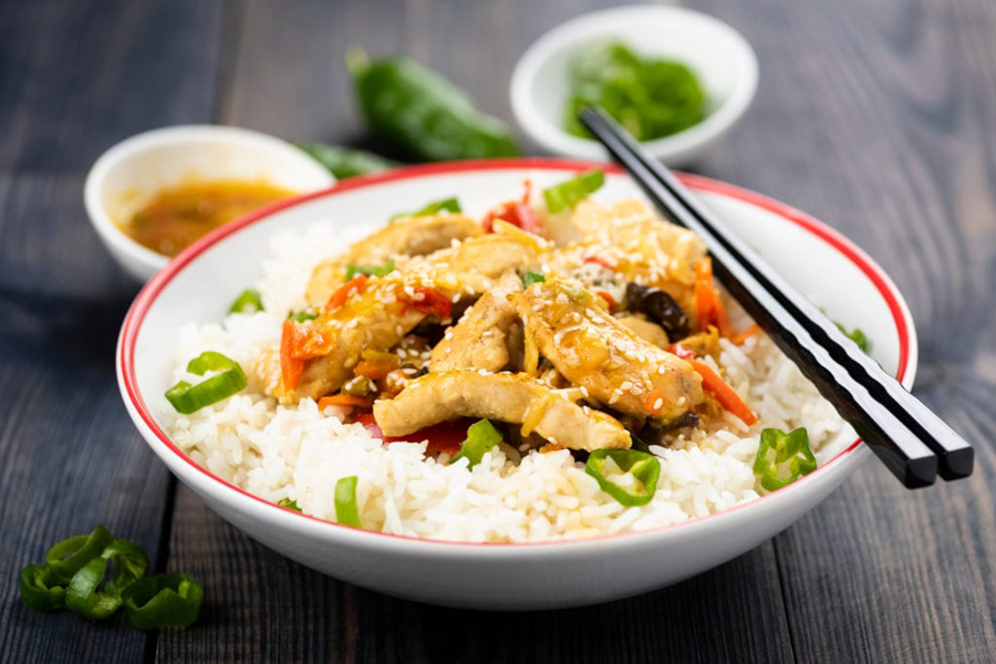 Stirfry Chicken with rice and chopsticks made with Cook's Delight Chicken Soup Base