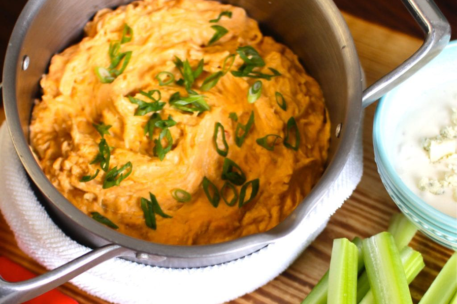 Buffalo Chicken dip with celery, blue cheese and Cook's Delight chicken soup base and chipotle base