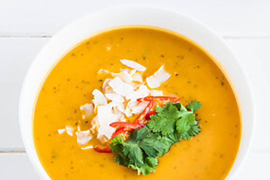 Bowl of Thai pumpkin soup with coconut milk and Cook's Delight Vegan Vegetable Soup Stock